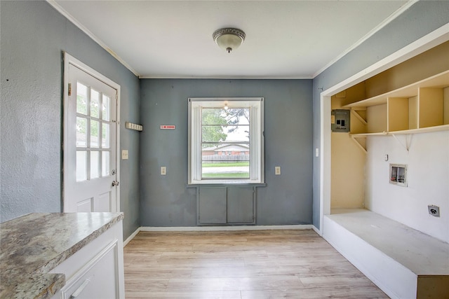 201 Brookhaven Ter, Commerce, TX 75428 - doorway featuring light wood-style floors, plenty of natural light, ornamental molding, and baseboards