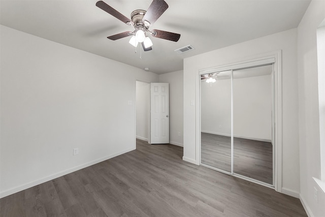 2508 Windsor Ave, Waco, TX 76708 - unfurnished bedroom with wood finished floors, baseboards, a closet, and a ceiling fan