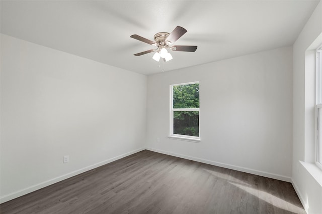 2508 Windsor Ave, Waco, TX 76708 - unfurnished room with dark wood-style floors, a ceiling fan, and baseboards