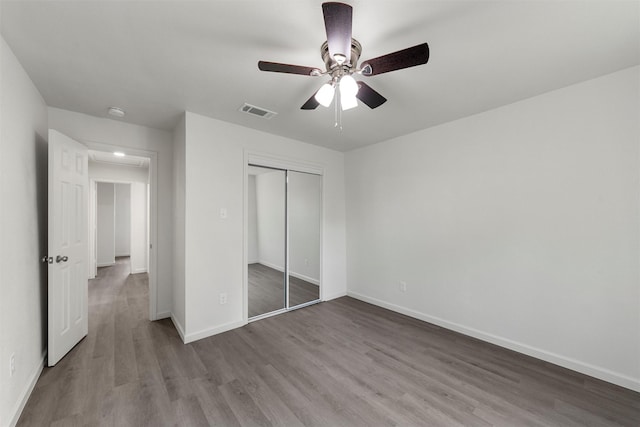 2508 Windsor Ave, Waco, TX 76708 - unfurnished bedroom featuring wood finished floors, a closet, baseboards, and a ceiling fan