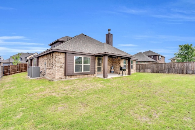 2417 Warrington Pl, Mansfield, TX 76084 - rear view of property with central AC unit, a chimney, brick siding, and a patio area