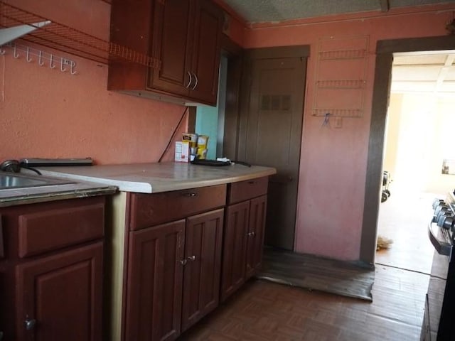 3409 Reed St, Fort Worth, TX 76119 - kitchen featuring light countertops, range, and a sink