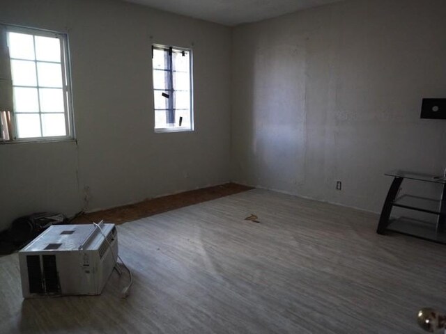 3409 Reed St, Fort Worth, TX 76119 - spare room featuring plenty of natural light and wood finished floors