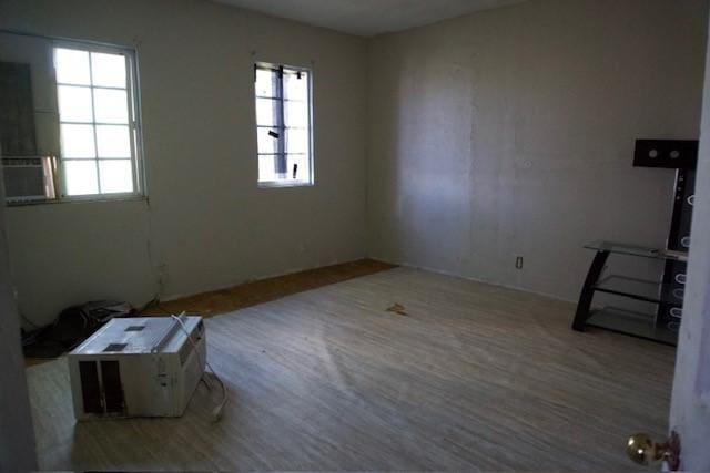 3409 Reed St, Fort Worth, TX 76119 - spare room with plenty of natural light and wood finished floors