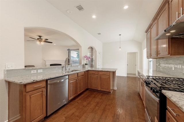 1605 Tanglewood Dr, Allen, TX 75002 - kitchen featuring stainless steel appliances, a sink, vaulted ceiling, range hood, and dark wood-type flooring