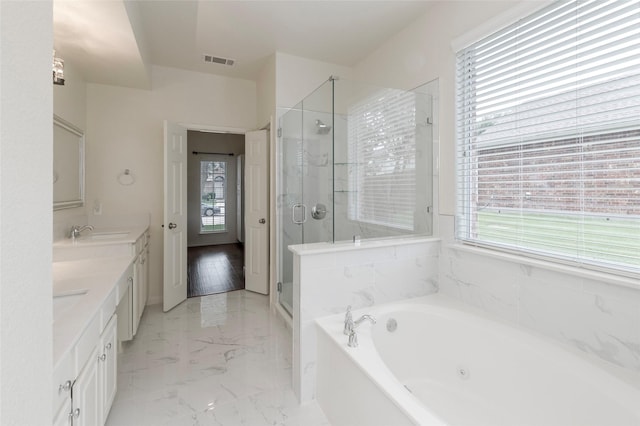 1605 Tanglewood Dr, Allen, TX 75002 - full bathroom featuring healthy amount of natural light, a jetted tub, double vanity, and a stall shower