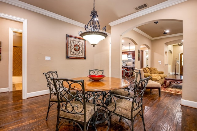 11626 Coronado Trl, Frisco, TX 75033 - dining space with arched walkways, dark wood-style flooring, baseboards, and crown molding