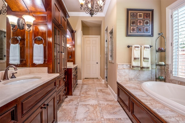 11626 Coronado Trl, Frisco, TX 75033 - bathroom with vanity, crown molding, a garden tub, baseboards, and a chandelier