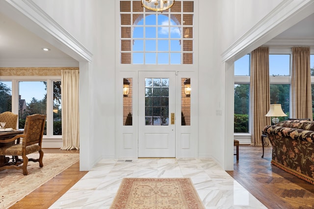 4417 Windsor Ridge Dr, Irving, TX 75038 - entryway featuring crown molding, a towering ceiling, a chandelier, recessed lighting, and baseboards