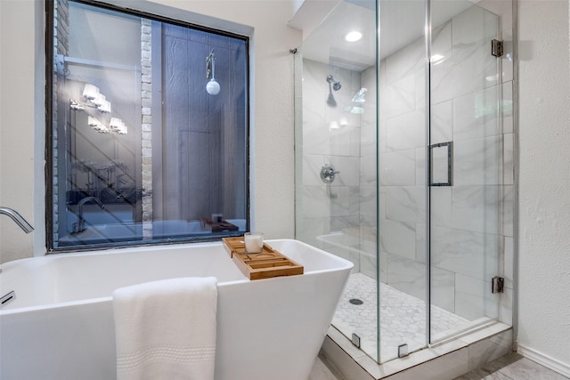 9502 Summerhill Ln, Dallas, TX 75238 - full bathroom with a soaking tub, a shower stall, and a textured wall