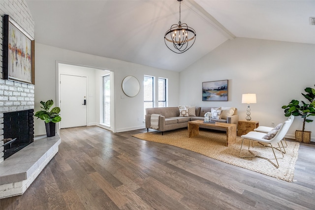 9502 Summerhill Ln, Dallas, TX 75238 - living area featuring wood finished floors, a brick fireplace, beam ceiling, baseboards, and a chandelier