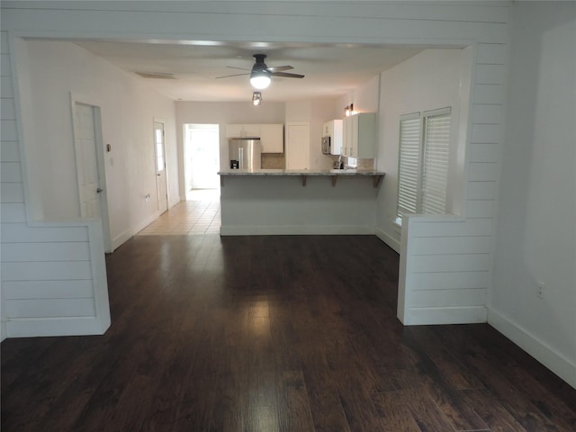 622 N Race, Stephenville, TX 76401 - kitchen featuring stainless steel appliances, dark wood finished floors, a peninsula, and baseboards