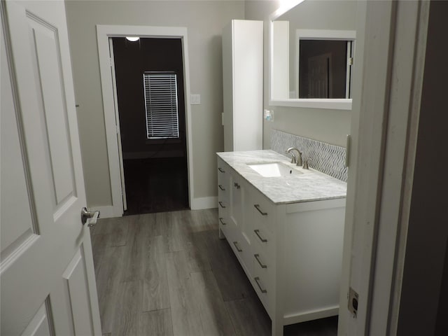 622 N Race, Stephenville, TX 76401 - bathroom with vanity and wood finished floors