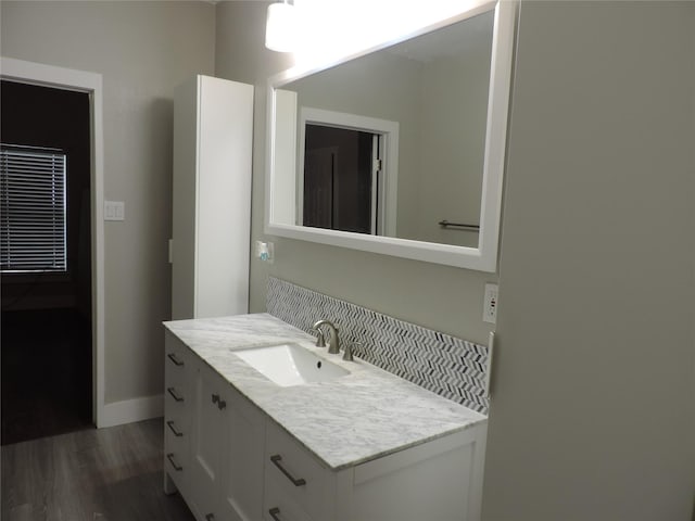 622 N Race, Stephenville, TX 76401 - bathroom with wood finished floors, vanity, and baseboards