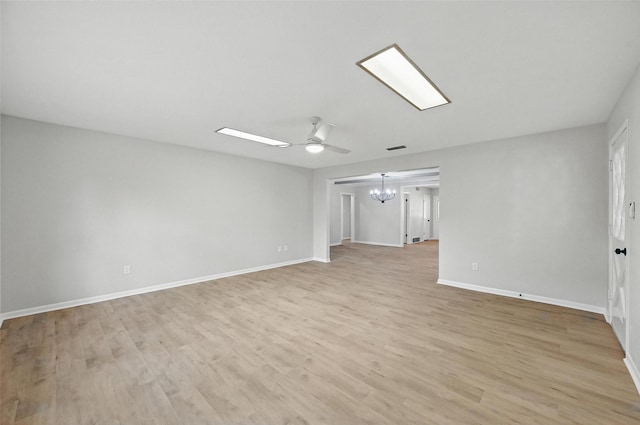 6729 Cylinda Sue Cir, North Richland Hills, TX 76180 - spare room featuring a chandelier, light wood-style flooring, and ceiling fan