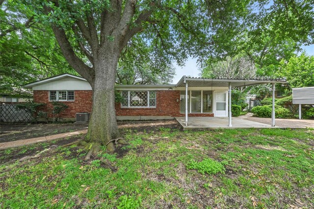 6729 Cylinda Sue Cir, North Richland Hills, TX 76180 - view of front facade with brick siding, a patio, and a carport