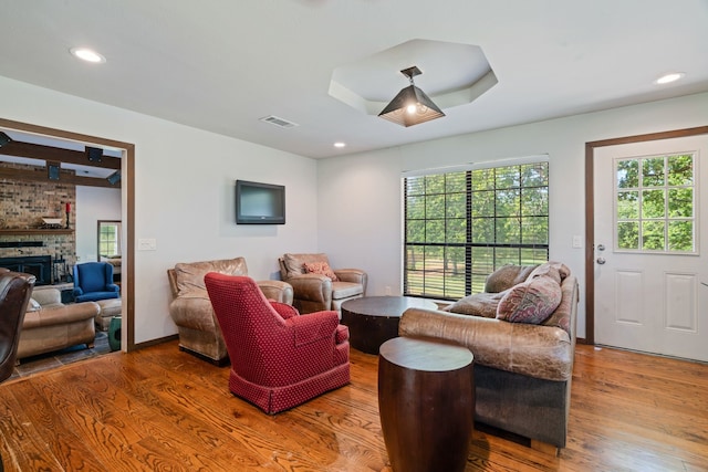3893 E Fm 906, Powderly, TX 75473 - living area with wood finished floors, a fireplace, and recessed lighting