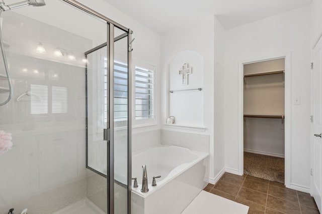 5016 Coney Island Dr, Frisco, TX 75036 - full bath featuring a stall shower, a garden tub, a spacious closet, tile patterned floors, and baseboards
