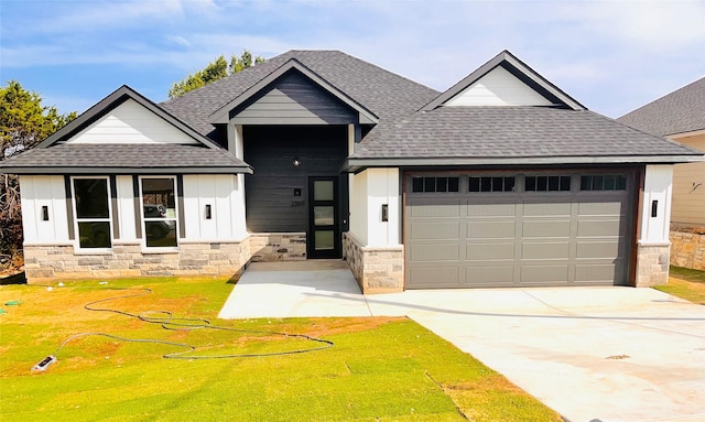 2309 Forest Hill Ln, Granbury, TX 76048 - view of front of house featuring roof with shingles, an attached garage, and stone siding