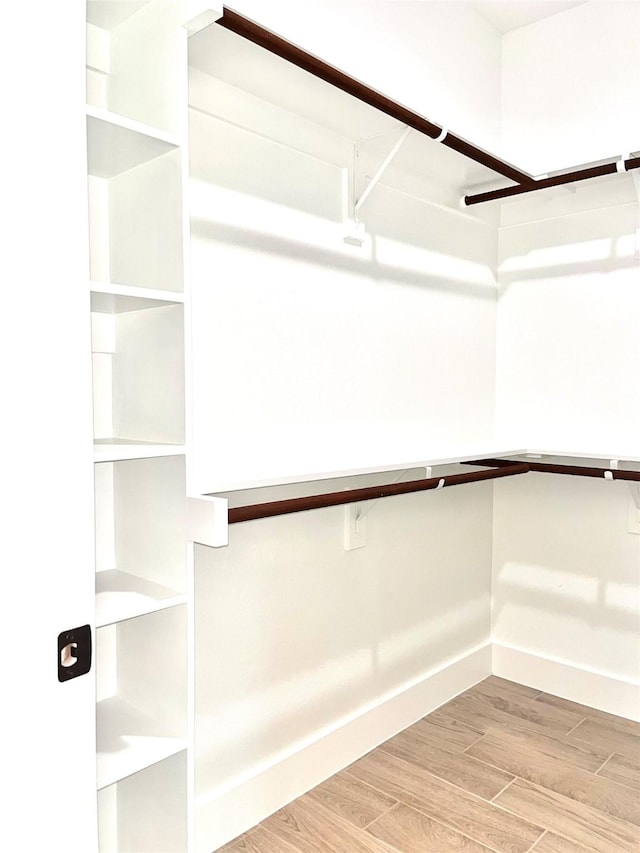 2309 Forest Hill Ln, Granbury, TX 76048 - walk in closet featuring wood finished floors
