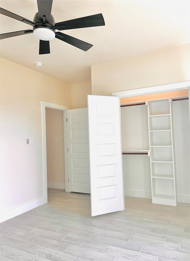 2309 Forest Hill Ln, Granbury, TX 76048 - unfurnished bedroom featuring baseboards, a closet, and light wood-style flooring