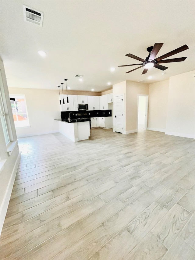 2309 Forest Hill Ln, Granbury, TX 76048 - unfurnished living room featuring ceiling fan, recessed lighting, and baseboards
