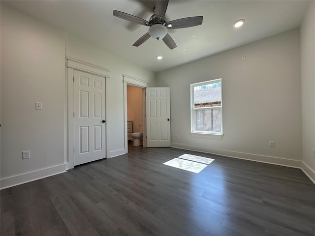 907 Davis St S, Sulphur Springs, TX 75482 - unfurnished bedroom with baseboards, dark wood-style floors, recessed lighting, ensuite bathroom, and ceiling fan