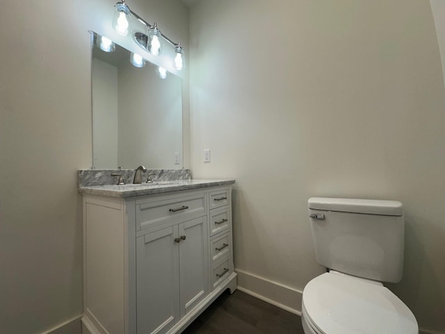 907 Davis St S, Sulphur Springs, TX 75482 - half bathroom with baseboards, toilet, and vanity
