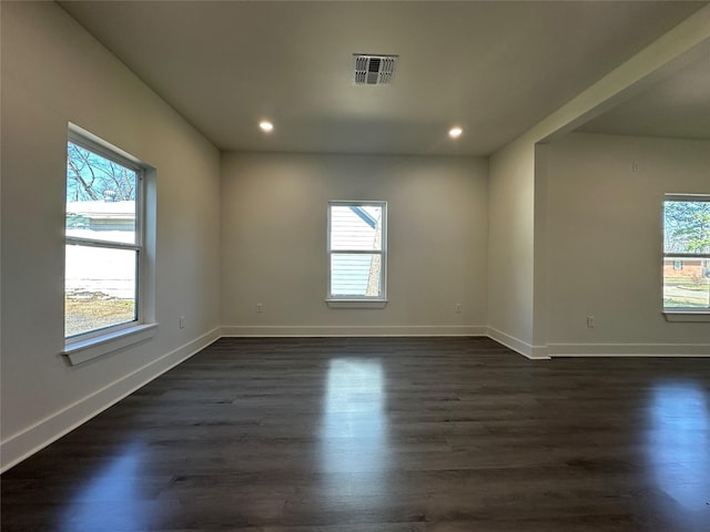 907 Davis St S, Sulphur Springs, TX 75482 - spare room with plenty of natural light, baseboards, recessed lighting, and dark wood-style floors