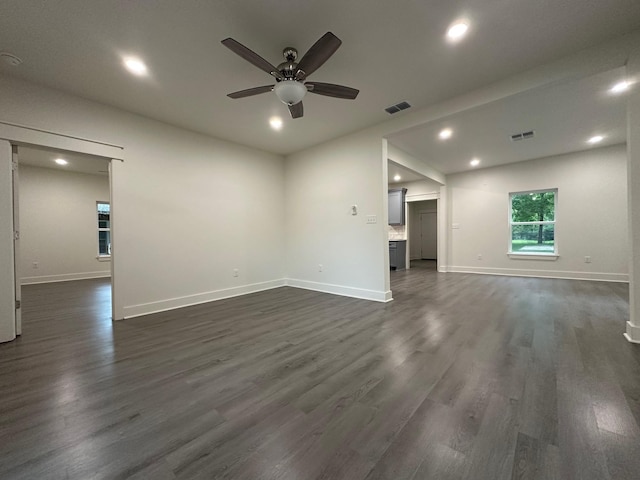 907 Davis St S, Sulphur Springs, TX 75482 - unfurnished living room featuring a ceiling fan, recessed lighting, dark wood-style floors, and baseboards
