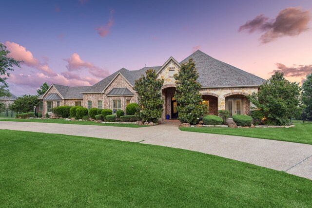 2711 Bauer Ct, Lucas, TX 75002 - french country home with stone siding, a yard, brick siding, and a standing seam roof