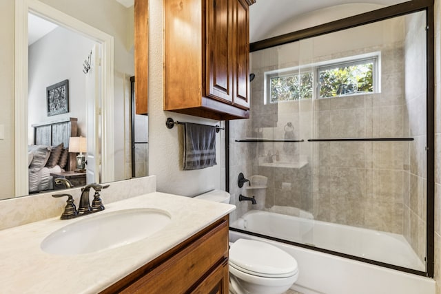2711 Bauer Ct, Lucas, TX 75002 - bathroom featuring toilet, vanity, and shower / bath combination with glass door