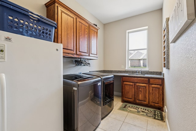 2711 Bauer Ct, Lucas, TX 75002 - laundry area featuring cabinet space, washing machine and dryer, and light tile patterned floors