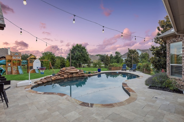2711 Bauer Ct, Lucas, TX 75002 - pool at dusk featuring a playground, a patio, a lawn, and an outdoor pool