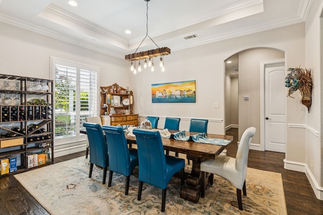 2711 Bauer Ct, Lucas, TX 75002 - dining space with a tray ceiling, arched walkways, ornamental molding, wood finished floors, and recessed lighting