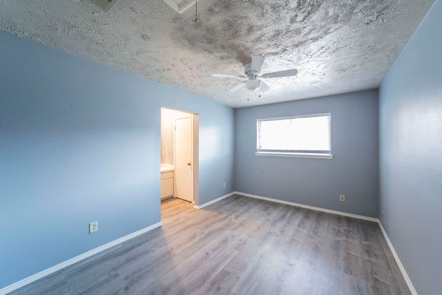 24 W Mountain Creek Dr, Grand Prairie, TX 75052 - unfurnished room featuring wood finished floors, a ceiling fan, baseboards, and a textured ceiling