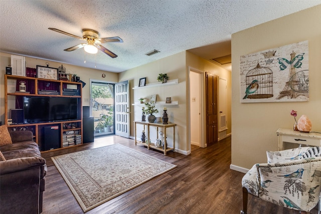 416 S 1st St, Wylie, TX 75098 - living area with a textured ceiling, a ceiling fan, wood finished floors, and baseboards