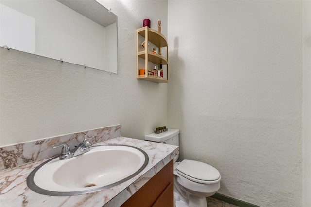 416 S 1st St, Wylie, TX 75098 - bathroom with toilet, vanity, and a textured wall