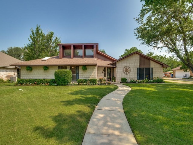 1507 Juniper Ln, Lewisville, TX 75077 - mid-century modern home featuring central AC, brick siding, and a front lawn