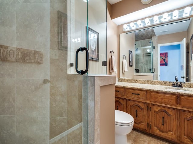 1507 Juniper Ln, Lewisville, TX 75077 - full bathroom featuring a stall shower, vanity, toilet, and tile patterned floors