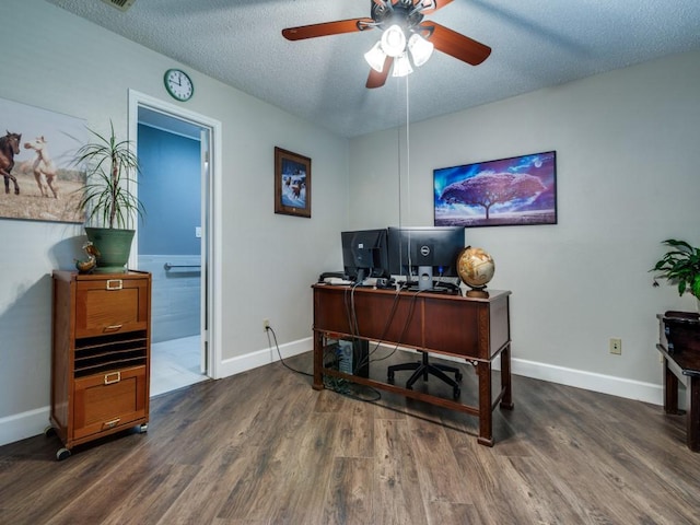 1507 Juniper Ln, Lewisville, TX 75077 - office area featuring wood finished floors, a textured ceiling, ceiling fan, and baseboards