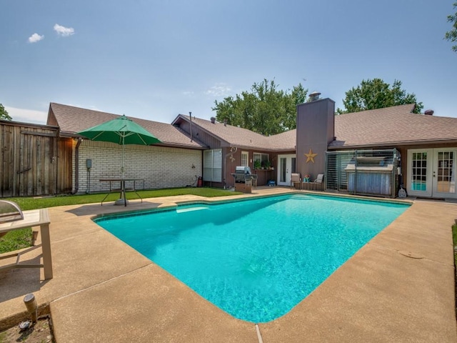 1507 Juniper Ln, Lewisville, TX 75077 - view of swimming pool featuring french doors and a patio area