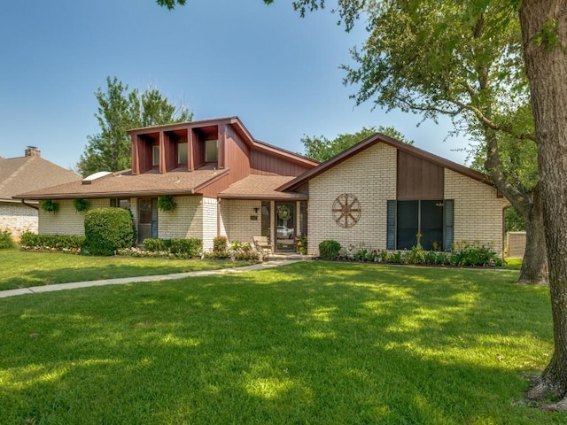 1507 Juniper Ln, Lewisville, TX 75077 - mid-century inspired home with brick siding and a front lawn