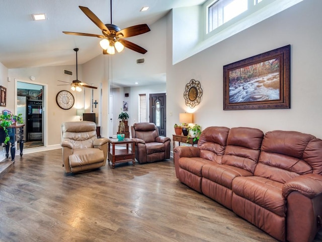 1507 Juniper Ln, Lewisville, TX 75077 - living area featuring ceiling fan, wood finished floors, plenty of natural light, and high vaulted ceiling