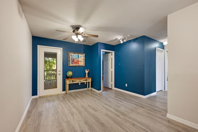 5033 Glenscape Trl, Fort Worth, TX 76137 - unfurnished room with wood finished floors, ceiling fan, baseboards, and rail lighting