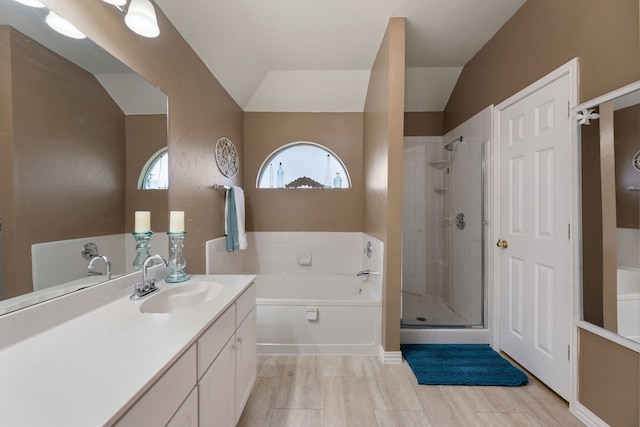 5033 Glenscape Trl, Fort Worth, TX 76137 - full bathroom with vanity, a garden tub, a shower stall, and vaulted ceiling