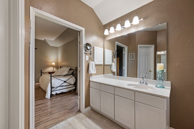 5033 Glenscape Trl, Fort Worth, TX 76137 - bathroom with vanity, lofted ceiling, and baseboards