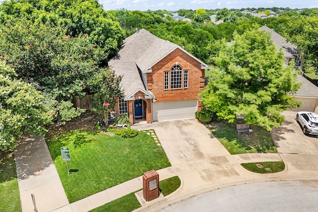 5033 Glenscape Trl, Fort Worth, TX 76137 - traditional-style home featuring brick siding, concrete driveway, an attached garage, a front lawn, and roof with shingles