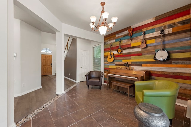 5033 Glenscape Trl, Fort Worth, TX 76137 - sitting room featuring wooden walls, a chandelier, dark tile patterned floors, and baseboards
