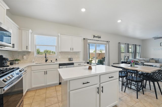 8048 Crimea Ln, Fort Worth, TX 76123 - kitchen with a sink, stainless steel appliances, plenty of natural light, open floor plan, and recessed lighting